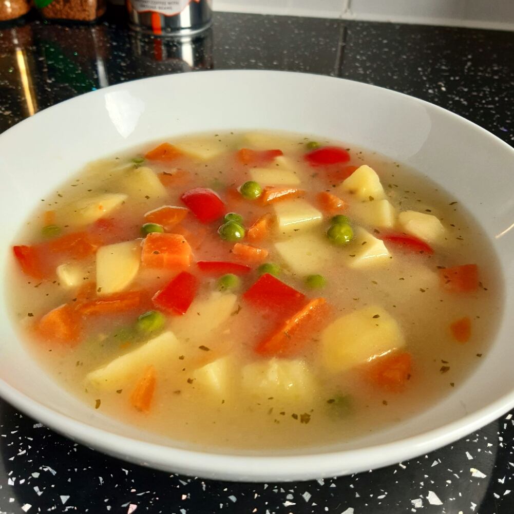 a bowl of spring vegetable soup