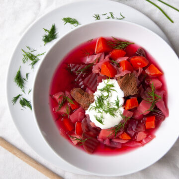 Borscht served with soured cream and fresh dill