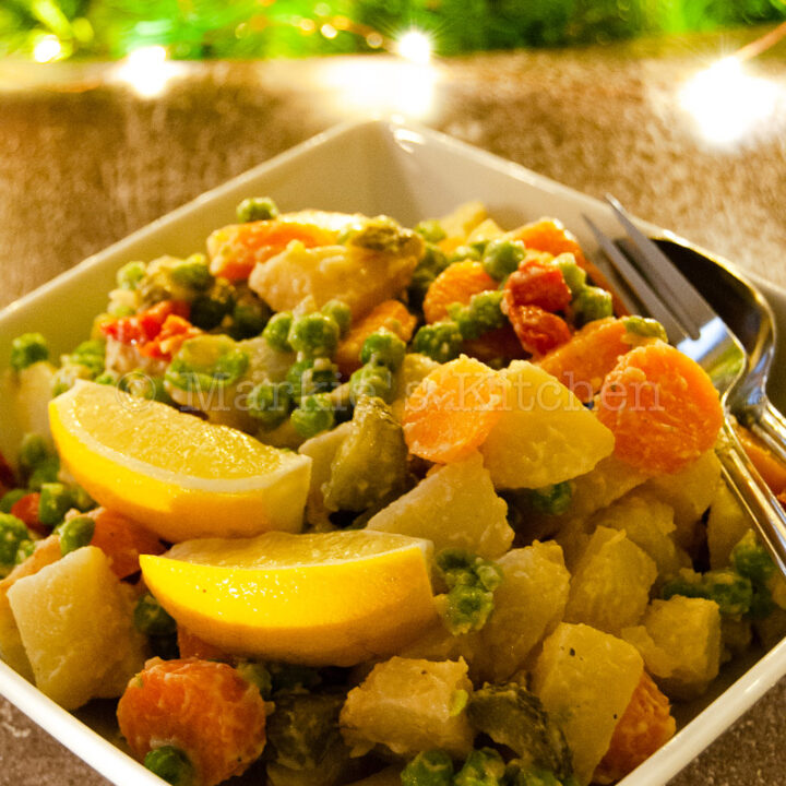 A bowl of potato salad in festive setting
