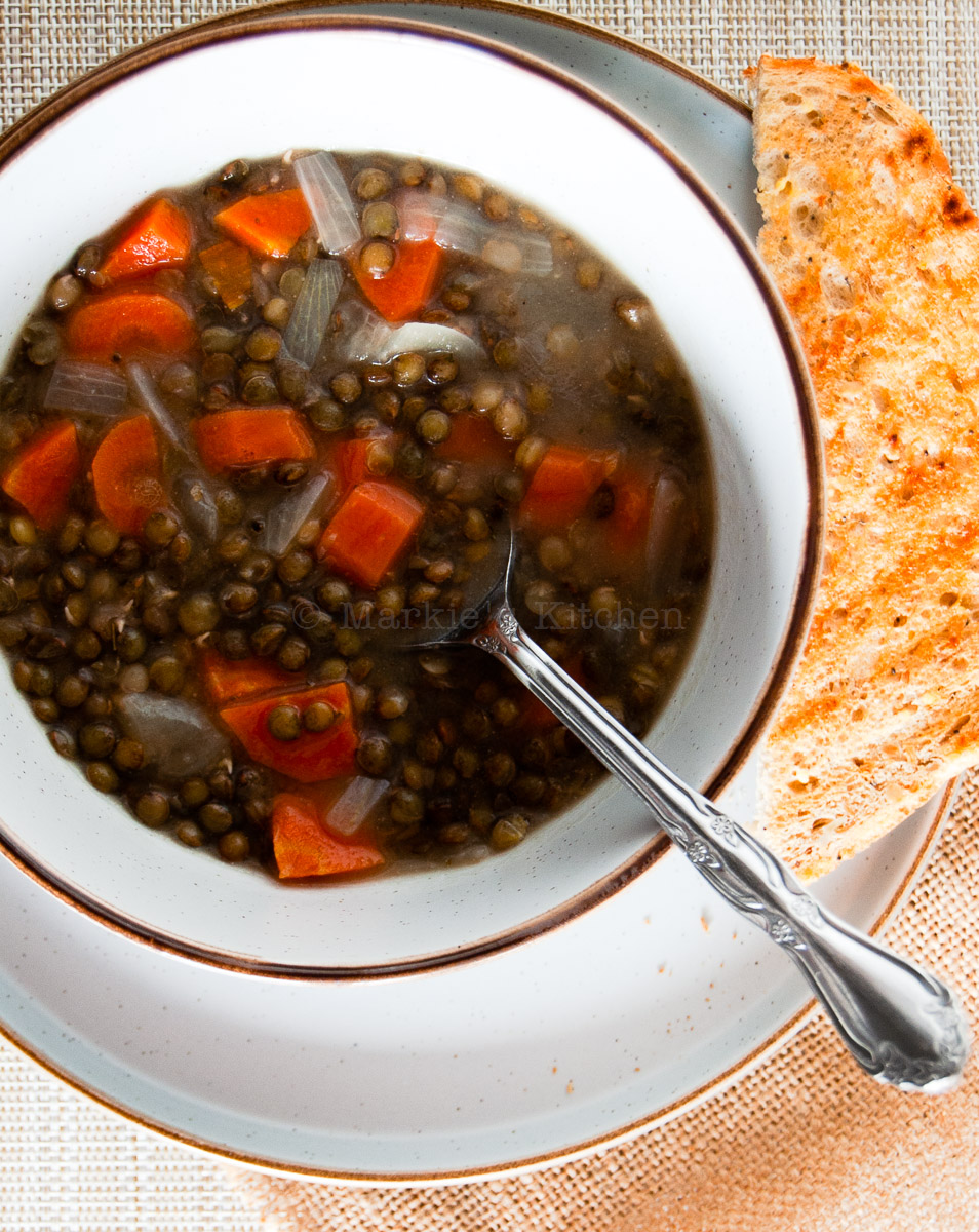 Lentil soup served with a slice of toast